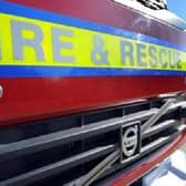 Firefighters in dry suits waded in to rescue occupants of a car that ran into the River Skirth at Billinghay.