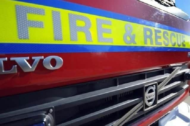 Firefighters in dry suits waded in to rescue occupants of a car that ran into the River Skirth at Billinghay.