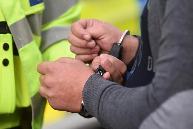 File photo dated 22/10/14 of an uninsured driver is handcuffed by police for breach of the peace. Campaigners have called on the Government to rethink its plans to change protest laws after journalists covering Just Stop Oil demonstrations were arrested. Issue date: Saturday November 12, 2022.