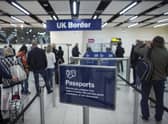 Border Force check the passports of passengers arriving. Photo: Getty Images