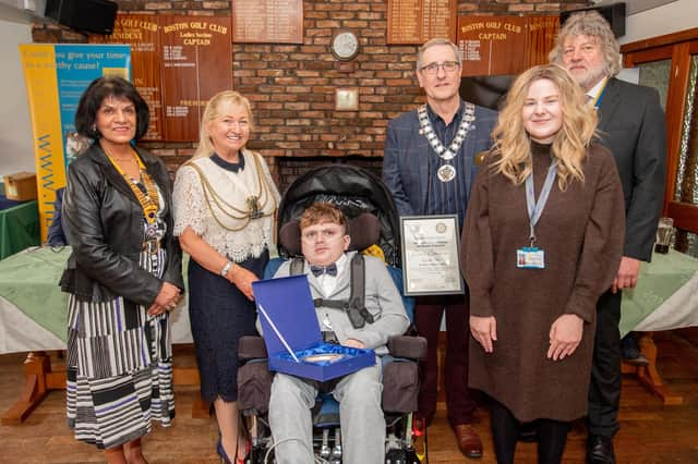 Kayden Haw with his Children of Courage Award, pictured alongside Boston Mayor, Coun Anne Dorrian. Rotary Club members and Kayden's teacher.