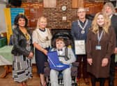 Kayden Haw with his Children of Courage Award, pictured alongside Boston Mayor, Coun Anne Dorrian. Rotary Club members and Kayden's teacher.