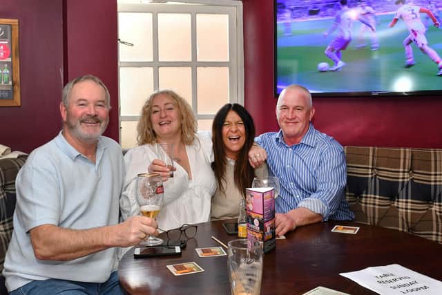Tim Dickens, Juzi Gough - daughter of Tom Daley, who was goalkeeper for Grimsby Town in the 1950’s -  Mandy Dickens, and Andy Gough cheer on the Mariners in the Pack Horse.