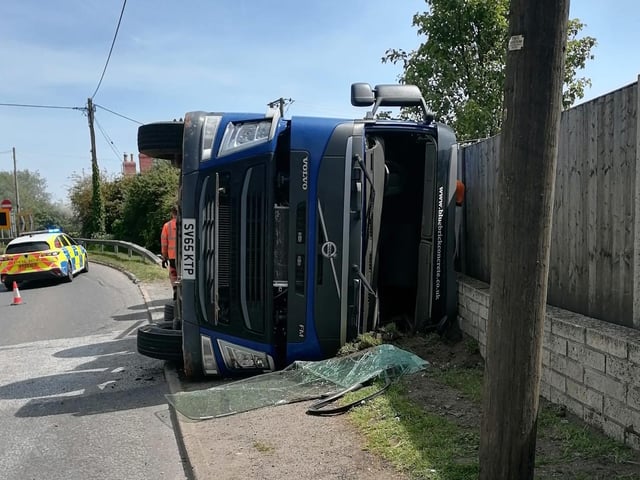 The truck ended up tipping over onto the pavement where a pedestrian had been just moments earlier.