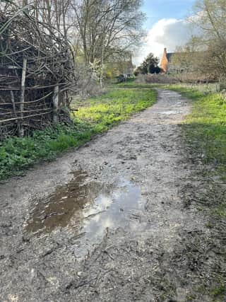 The muddy path through Lollycocks Field due to be upgraded.