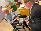 A veteran in a Lincolnshire care home receives a visit from the charity.