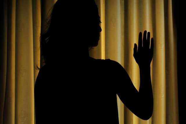 PICTURE POSED BY MODEL. A woman showing signs of depression.