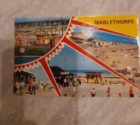 The postcard sent between the families.