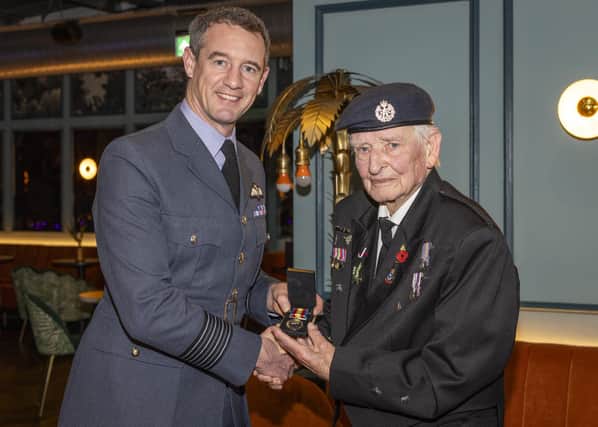 Station Commander RAF Coningsby, Group Captain Billy Cooper presented the Nuclear Test Medal to retired RAF Firefighter, John, ‘Dusty’ Millar. Photo: UK MOD Crown Copyright 2023
