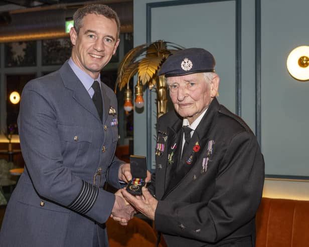 Station Commander RAF Coningsby, Group Captain Billy Cooper presented the Nuclear Test Medal to retired RAF Firefighter, John, ‘Dusty’ Millar. Photo: UK MOD Crown Copyright 2023