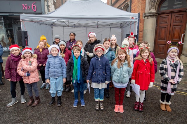 Young stagers singing Christmas songs at the Christmas Market.