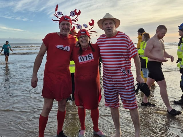 Mablethorpe Mayor Carl Tebbutt in red and white stripes and straw boater hat, with last year's Mayor Claire Arnold and her husband Chris dressed as lobsters. Photo: Carl Tebbutt