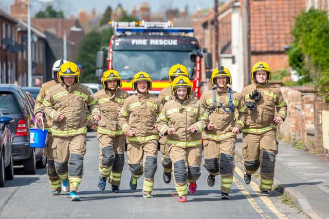 Horncastle firefighters running the final stretch from Woodhall Spa to Horncastle.