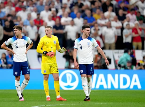 England's John Stones, goalkeeper Jordan Pickford and Declan Rice during the FIFA World Cup Quarter-Final match at the Al Bayt Stadium in Al Khor, Qatar. Picture: Nick Potts/PA Wire.