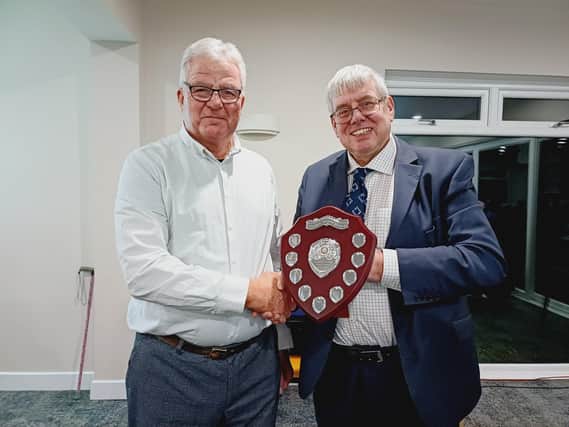 The Rev Canon Ian Robinson, right, received his award from Rotarian Peter Marriott
