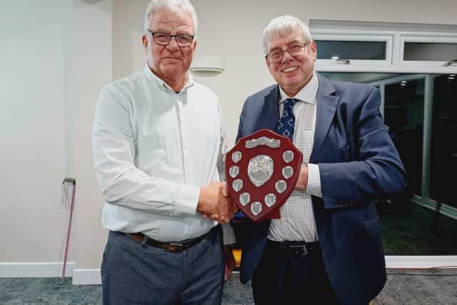 The Rev Canon Ian Robinson, right, received his award from Rotarian Peter Marriott
