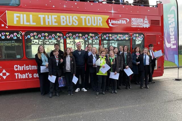 Stidents supporting the Lincs FM Mission Chrstmas appeal by filling a double decker bus with gifts for children in need.