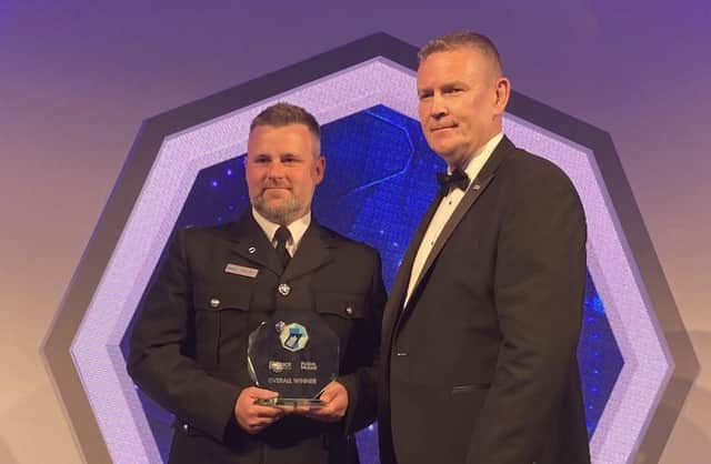PC Steve Denniss receives his award.