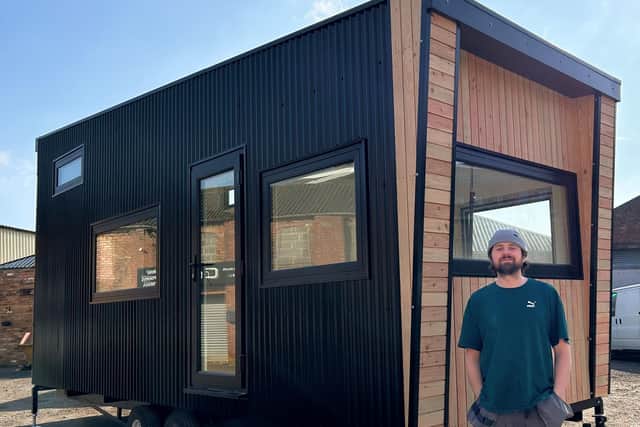 Vincent, founder of Your Small Space, proudly stands beside his first all-electric, energy-efficient tiny home, hand-built in Gainsborough and now available for sale.