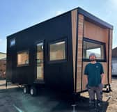 Vincent, founder of Your Small Space, proudly stands beside his first all-electric, energy-efficient tiny home, hand-built in Gainsborough and now available for sale.
