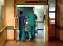 Orderlies push a bed at the Royal Orthopaedic Hospital, Oswestry.