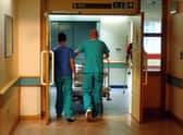 Orderlies push a bed at the Royal Orthopaedic Hospital, Oswestry.