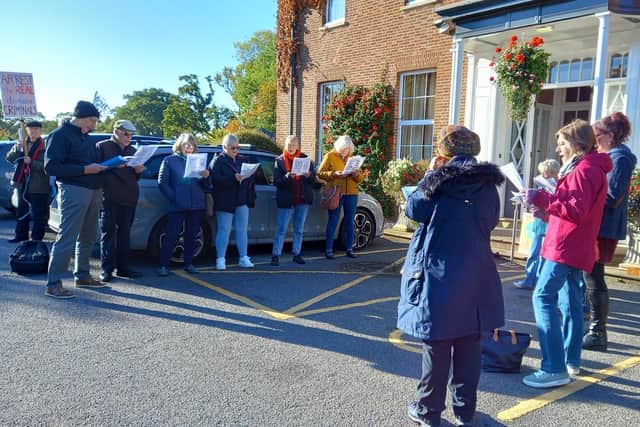 The campaigners sang songs before the meeting.