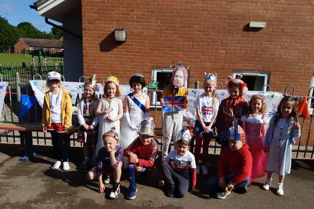 Caythorpe School pupils with their Platinum Jubilee banner.