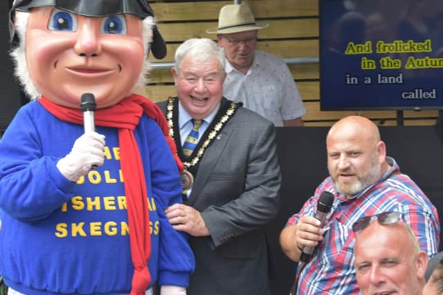Paul Dixon (right) with Mayor of Skegness Coun Pete Barry and the Jolly Fisherman. Photo: Barry Robinson.
