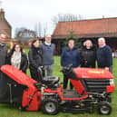 Coun Pete Barry (right) with the ride-on mower he presented to The Village Church Farm museum in Skegness. Also pictured are (from left) Simon Baker, Nicola Barry, Julie Hare,  Ernie Hare, Maxeen Walton and manager Naomi Walton. Photo: Pete Barry.