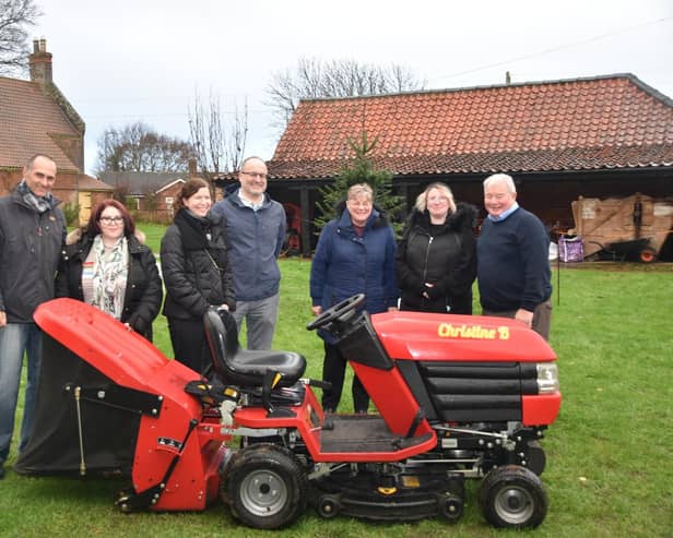 Coun Pete Barry (right) with the ride-on mower he presented to The Village Church Farm museum in Skegness. Also pictured are (from left) Simon Baker, Nicola Barry, Julie Hare,  Ernie Hare, Maxeen Walton and manager Naomi Walton. Photo: Pete Barry.