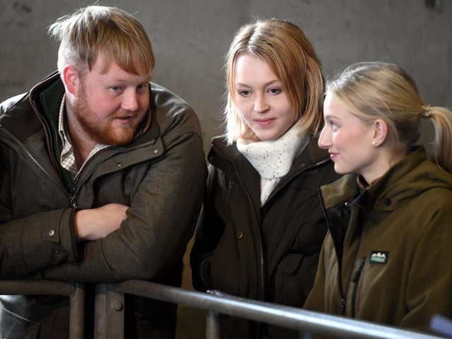 Kaleb Cooper offers guidance to Caitlyn Bartlett and Caitlin Oxton.