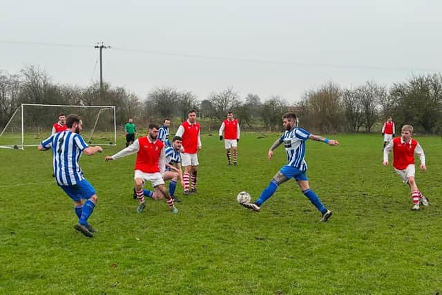 Action from Barnetby's (in red) win over Scotter.