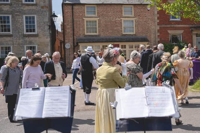 Georgian dancing lessons in the Market Place at Folkingham. Photo: Graydon Jones