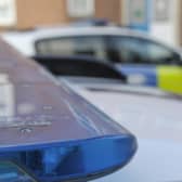 A four-year-old girl has died in a dog attack on Milton Keynes. File picture shows police cars.