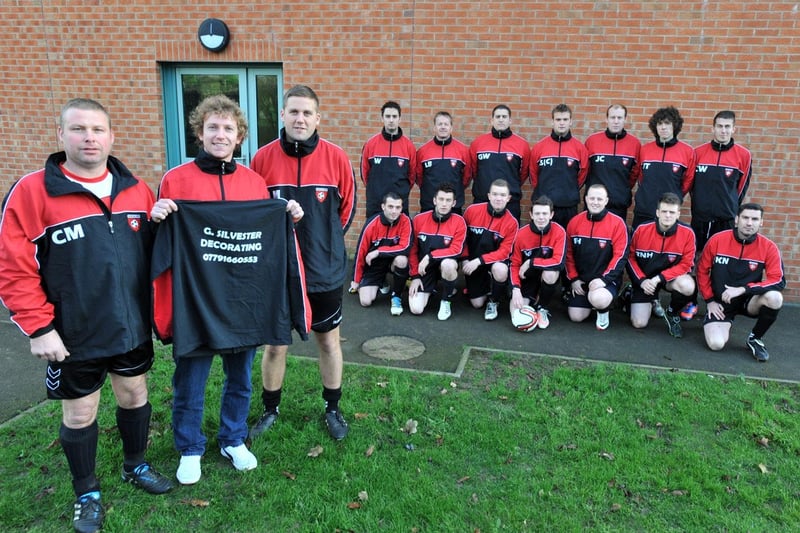 Louth Old Boys players, at the end of December 2012, sporting new tracksuits sponsored by G Silvester Decorating. Carl Munby, joint manager, is pictured thanking Graham Silvester, with Jordan Mackin, fellow joint manager.