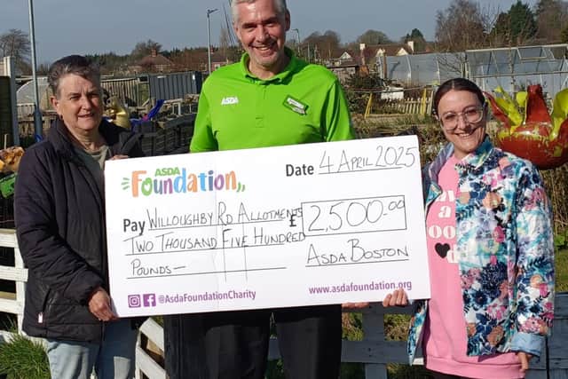 Asda Boston's Stephen Bromby with Gerry Ladds and Katie Epton from Willoughby Road Allotments.