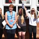 Sally Wharff, Haven High Academy's senior deputy headteacher, with pupils on GCSE results day.