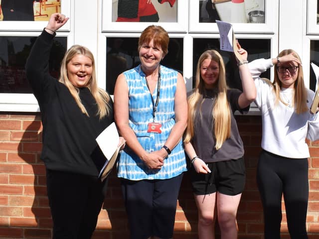 Sally Wharff, Haven High Academy's senior deputy headteacher, with pupils on GCSE results day.
