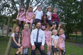 Head teacher Andrew Cook with just some of his pupils at Kelsey Primary School. Image: Dianne Tuckett