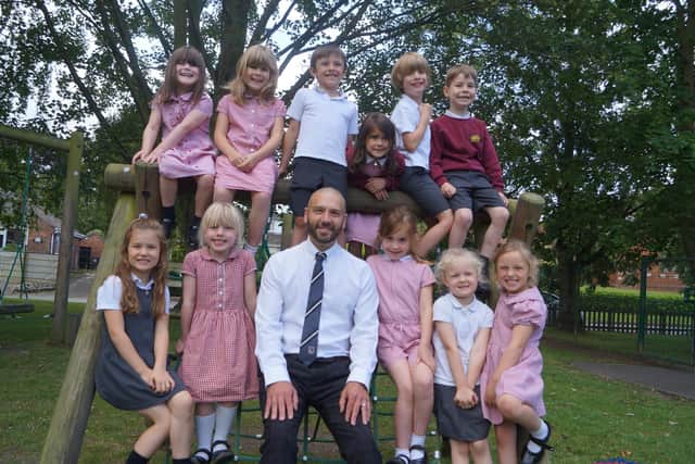 Head teacher Andrew Cook with just some of his pupils at Kelsey Primary School. Image: Dianne Tuckett