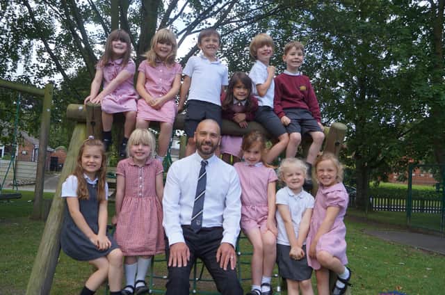 Head teacher Andrew Cook with just some of his pupils at Kelsey Primary School. Image: Dianne Tuckett