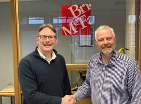 Dale Crombleholme (right) being congratulated on his achievement by Managing Partner Stephen Oldridge