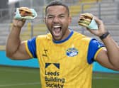 First men’s team captain of the Leeds Rhinos, Kruise Leeming, ‘try-s and tastes’ new Deliveroo x Hooyah Burgers exclusive Leeds Rhinos burger ahead of its launch on National Burger Day, August. 25 (photo: Doug Jackson/PinPep)