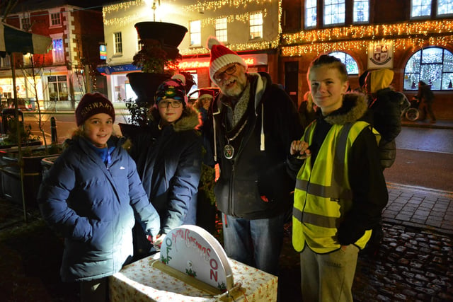Lucy from Osgodby Primary School and Oliver from Market Rasen Primary School were chosen to switch on the lights with town mayor Stephen Bunney