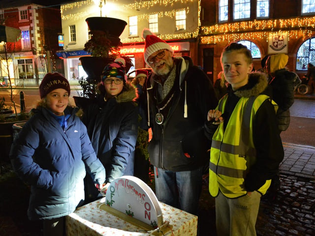 Lucy from Osgodby Primary School and Oliver from Market Rasen Primary School were chosen to switch on the lights with town mayor Stephen Bunney