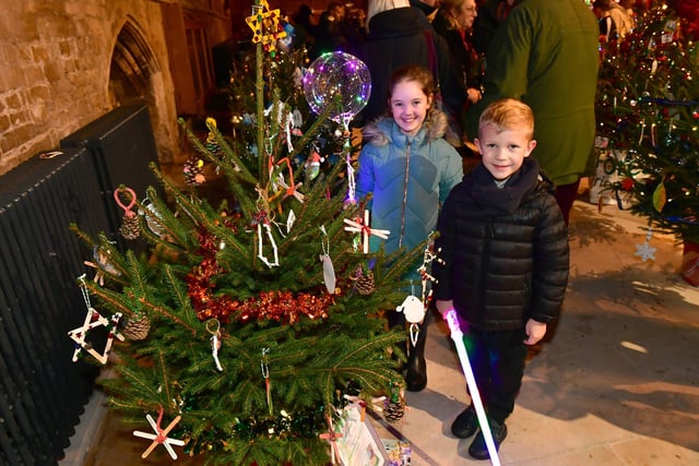 Harvey Forbes, 7, and Olivia Beasley, 8, with Christmas Trees in Boston Stump.