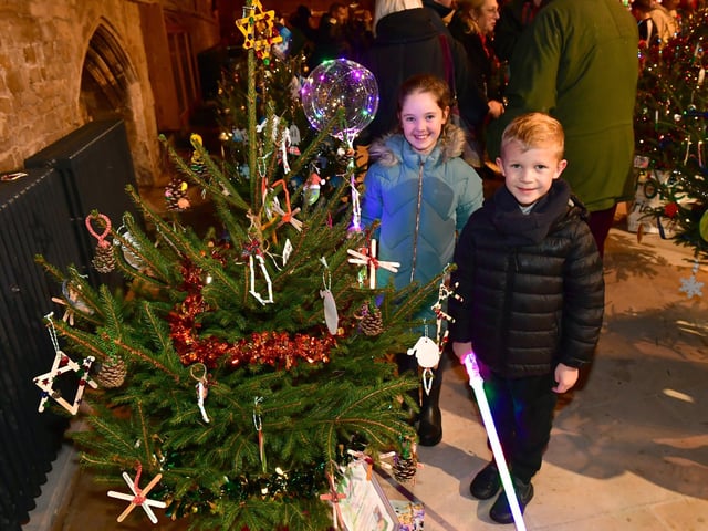 Harvey Forbes, 7, and Olivia Beasley, 8, with Christmas Trees in Boston Stump.