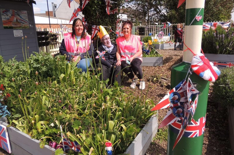 Sleaford area celebrate the King's Coronation.:Sam Bryant and Jane Peck of Rainbow Stars with the adopted station garden in Sleaford completed with their version of King Charles.