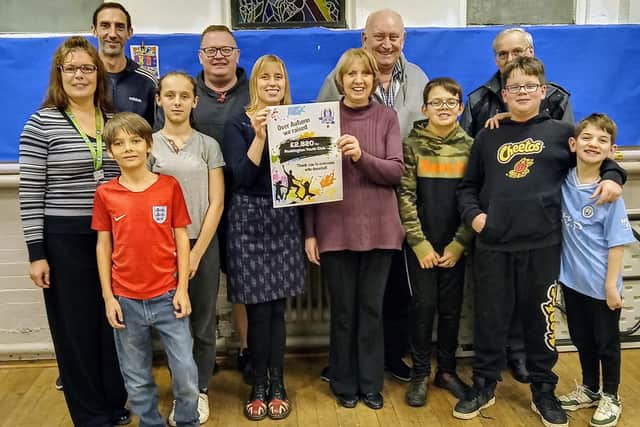 From left – stake holders, youth club leaders, committee members and youth club members Rachel Fox, Paul Harris, Rob Boyle,  Ayesha Copeland, Maggie Harris, Terry Boston, Dunstan Mallett, Cain, Lilly, Edward, Thomas and Sid. Photo submitted​​​​​​​​​​​​​​​​​​​​​​​​​​​​​​​​​​​​​​​​​​​​​​​​​​​​​​​​​​​​​​​​​​​​​​​​​​​​​​​​​​​​